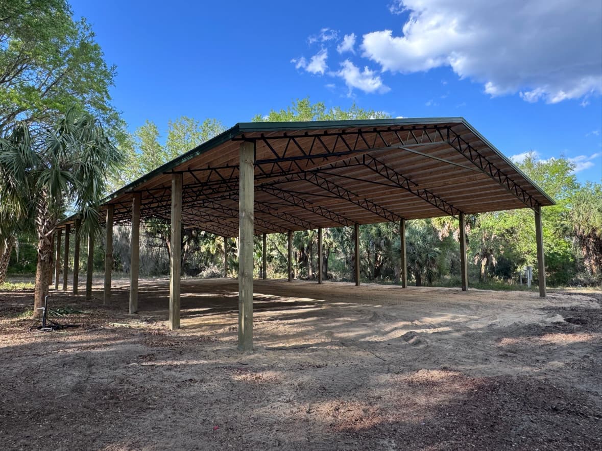 Open pole barn kit with metal roof in Central Florida